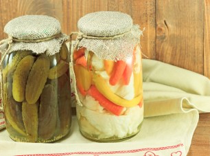 Mixed pickled vegetables in glass jars