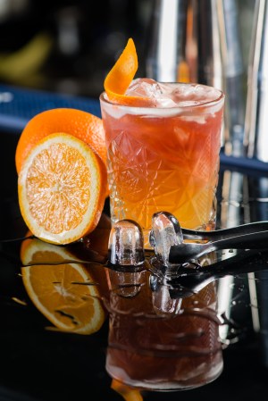 Fresh cocktail with orange and ice. Alcoholic, non-alcoholic dri