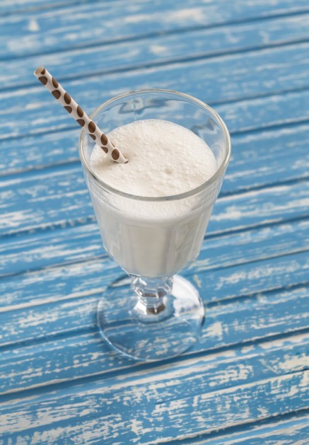 Ice cream milkshake on a blue wooden background