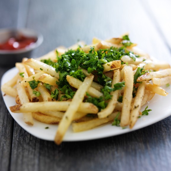 plate of truffle fries with parsley spread