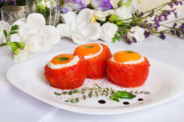 tomatoes stuffed eggs with basil and thyme sauce feeding festive celebration beautiful still life